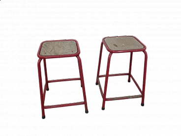 Pair of red iron and compressed wood stools, 1970s