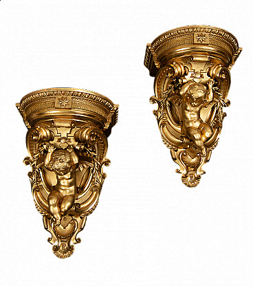 Pairs of Louis Philippe shelves in gilded and carved wood, 19th century