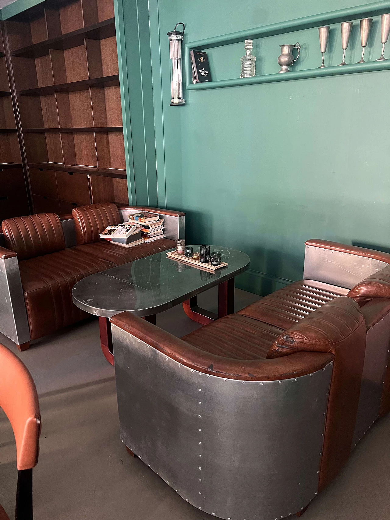 Pair of leather and metal Art Deco sofas and coffee table, 2000s 2