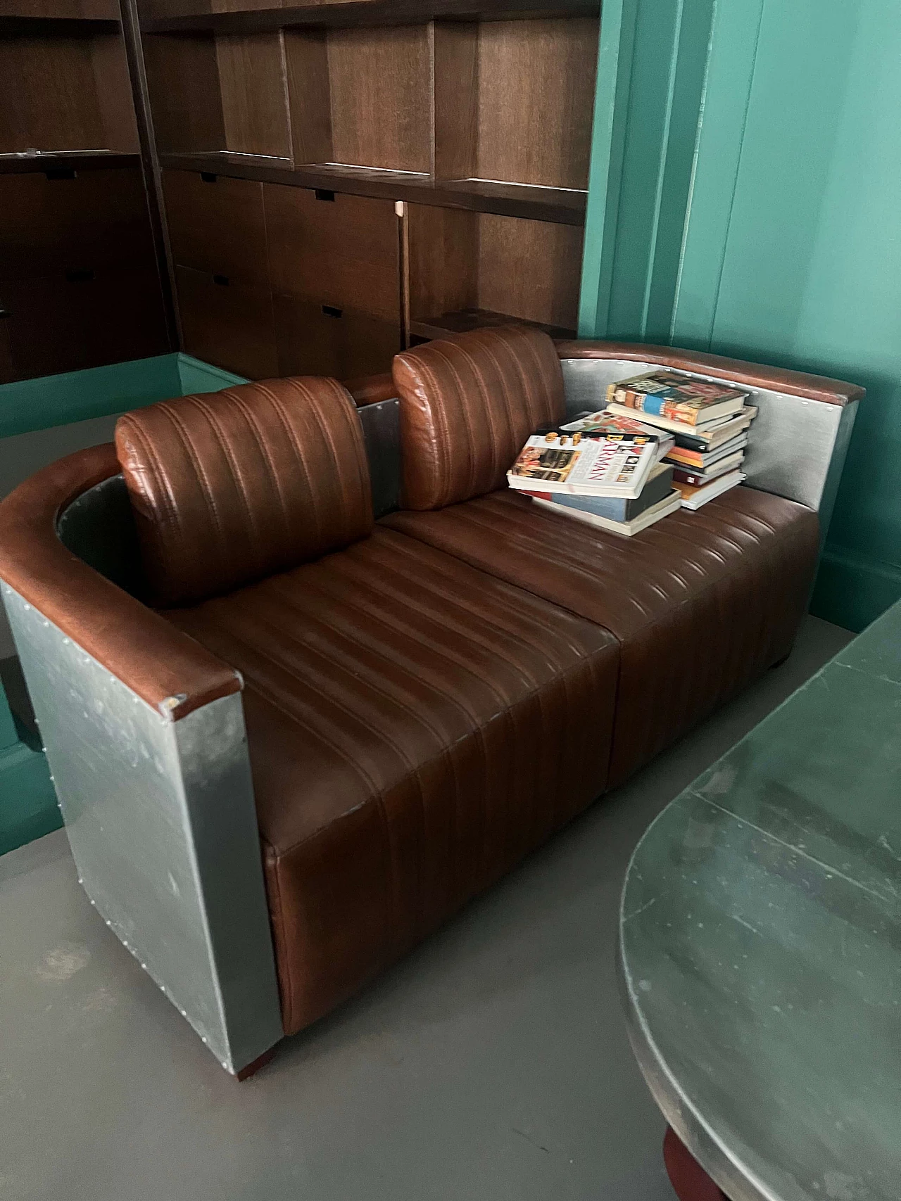 Pair of leather and metal Art Deco sofas and coffee table, 2000s 4