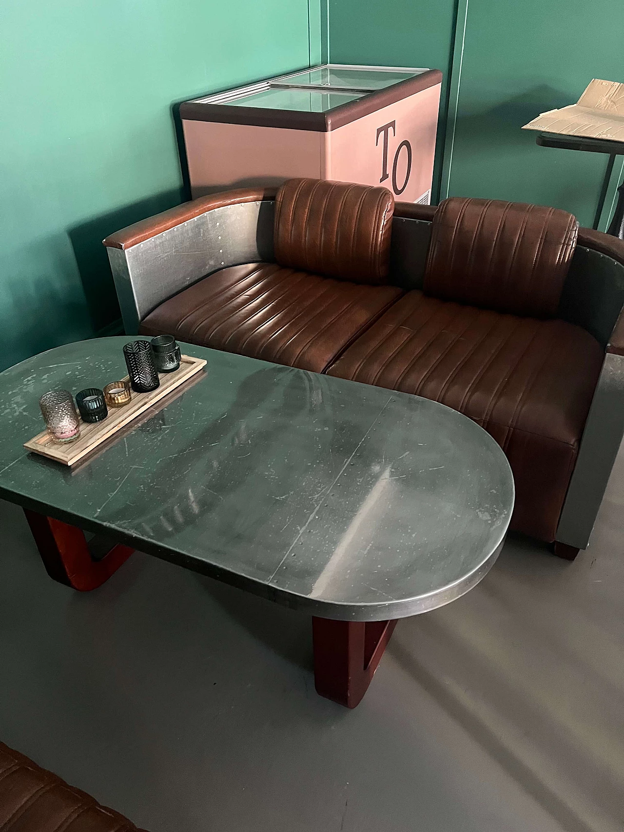 Pair of leather and metal Art Deco sofas and coffee table, 2000s 7