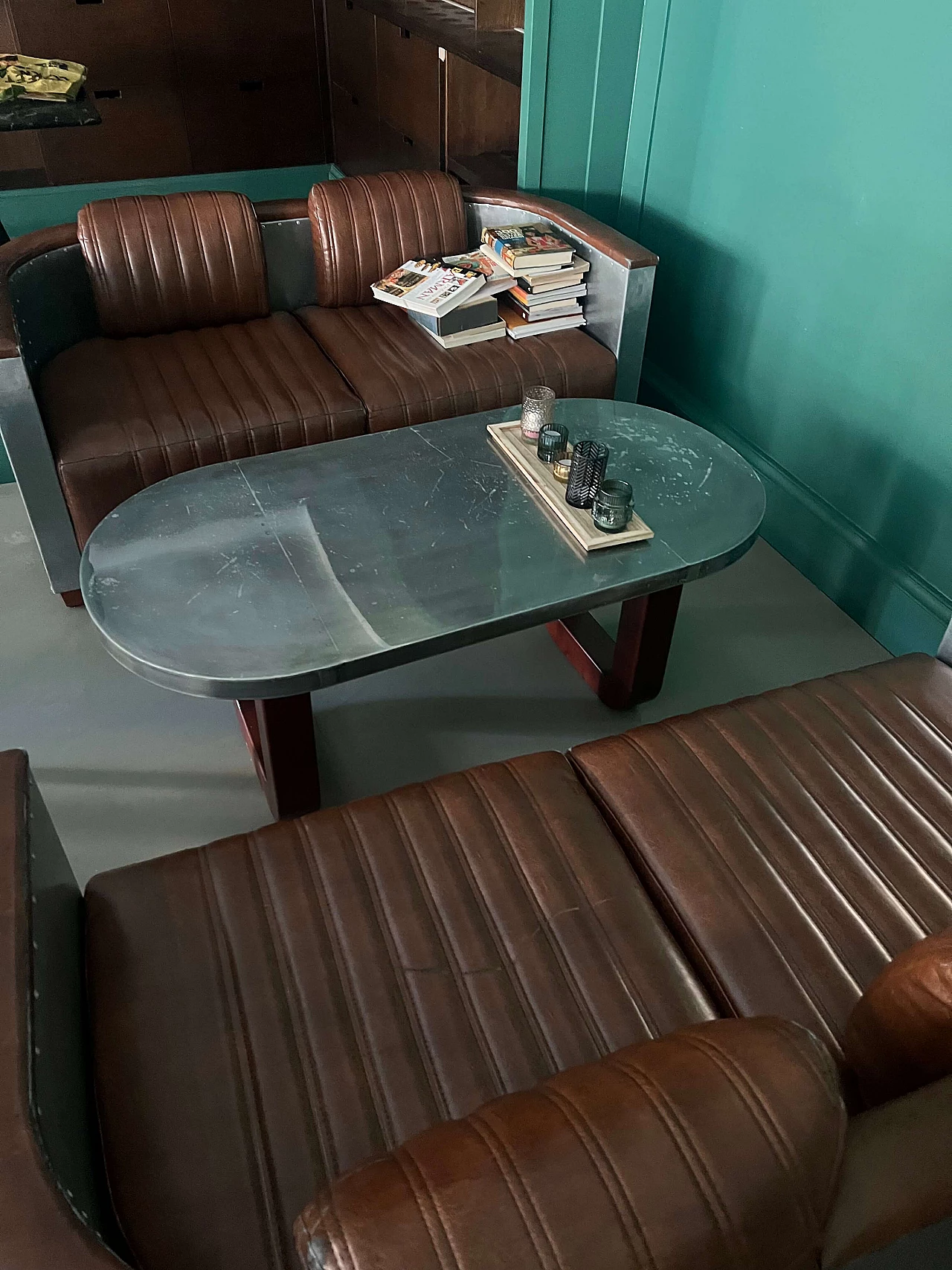Pair of leather and metal Art Deco sofas and coffee table, 2000s 8