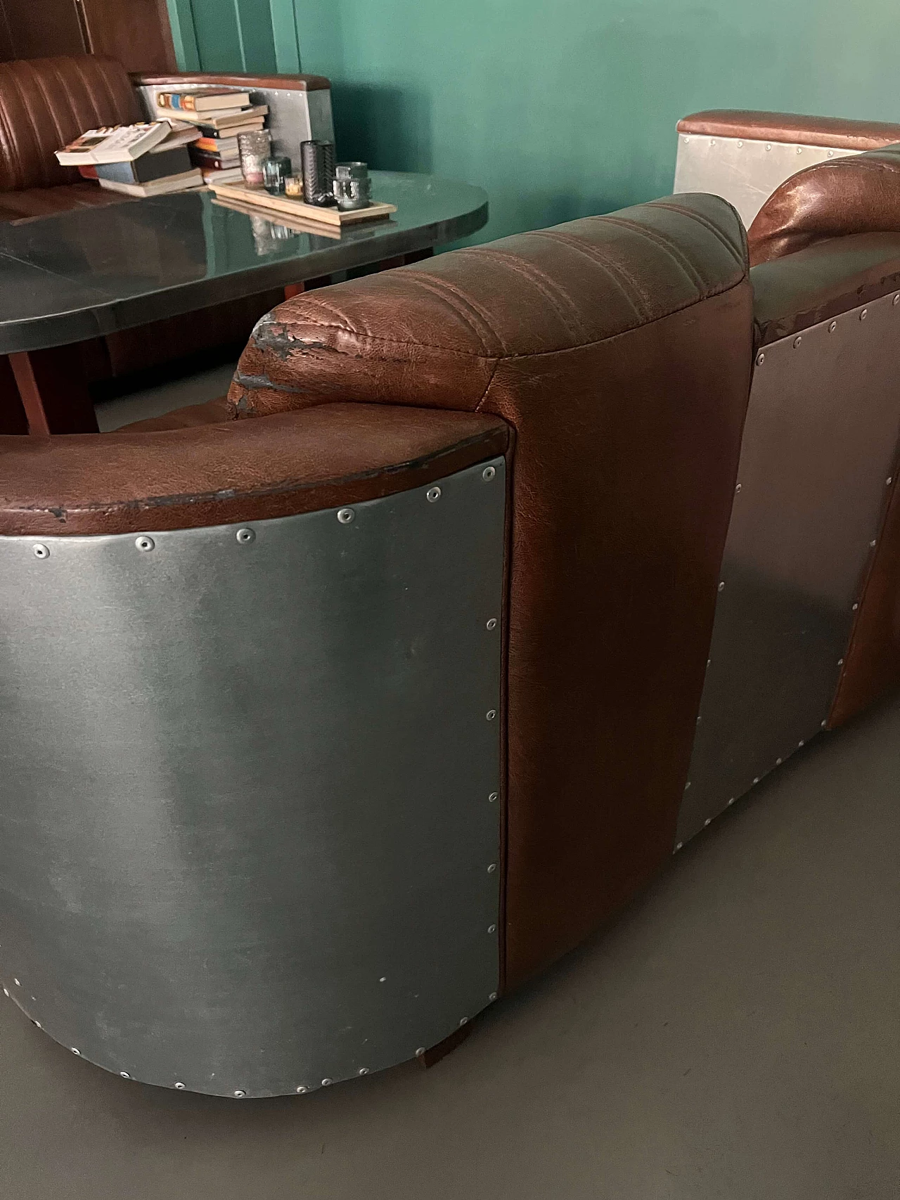Pair of leather and metal Art Deco sofas and coffee table, 2000s 9