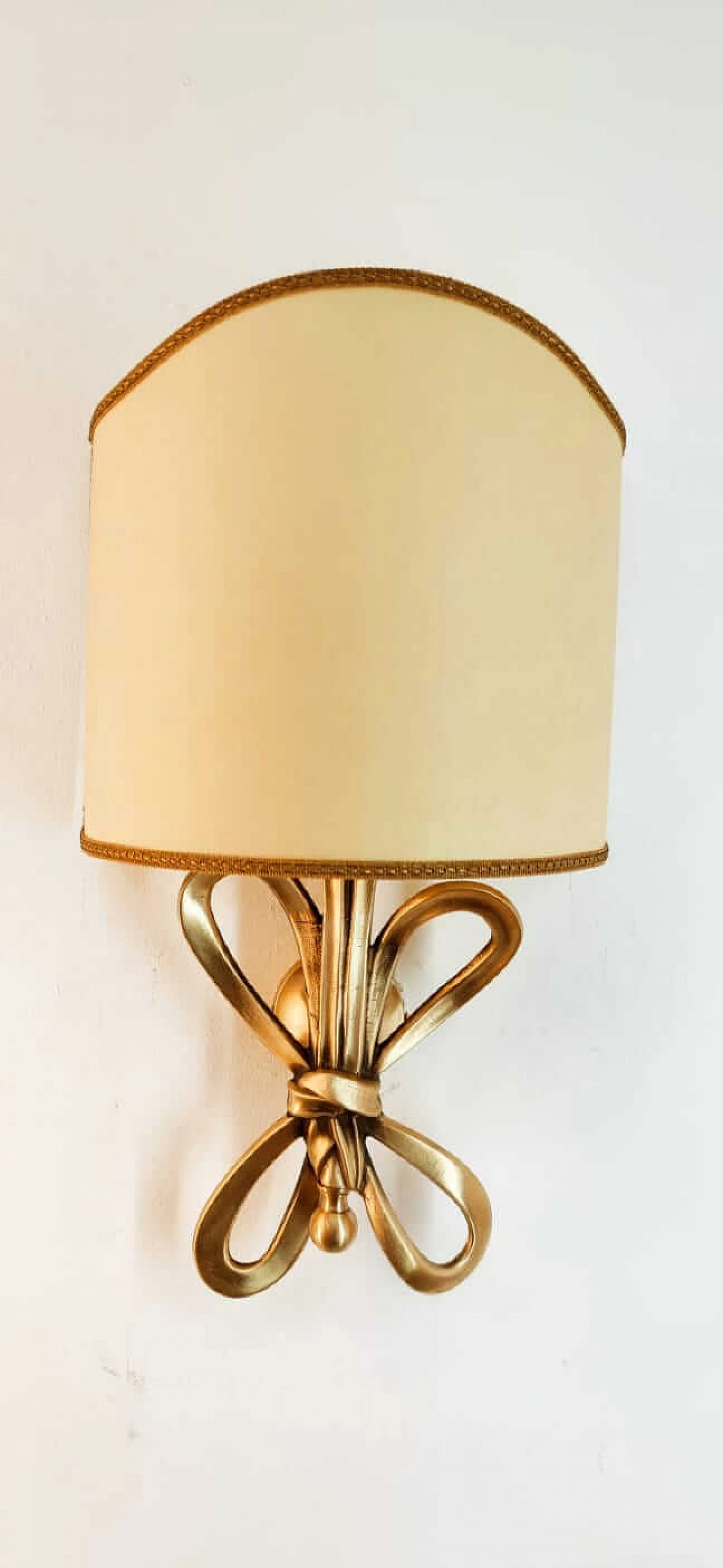 Wall sconce with brass bow and parchment fan diffuser, 1960s 1