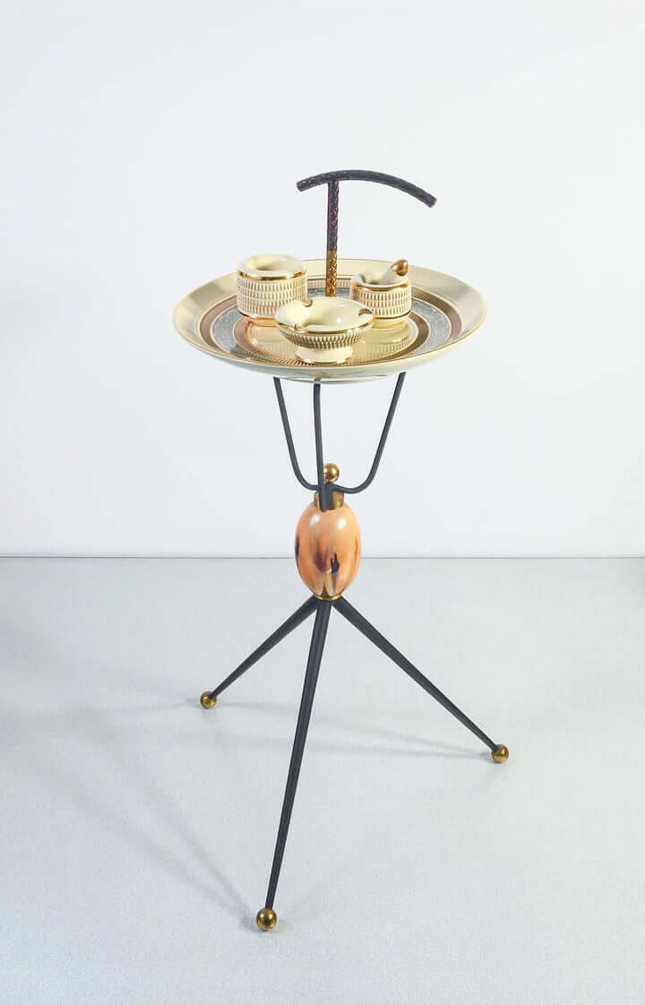 Ceramic and metal smoking accessories on tripod coffee table, 1960s 1