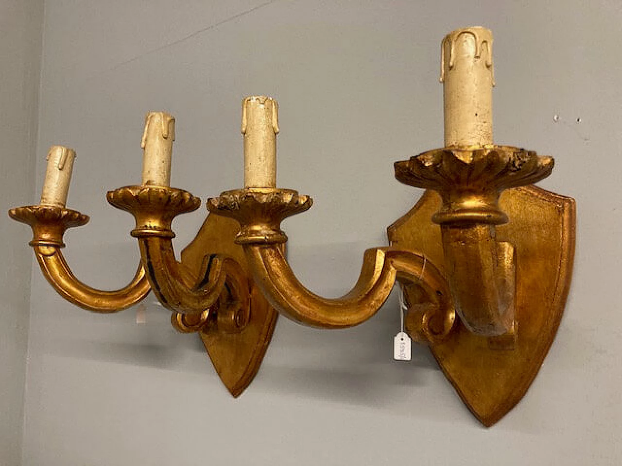 Pair of two-light carved and gilded wood wall lamps, 19th century 1