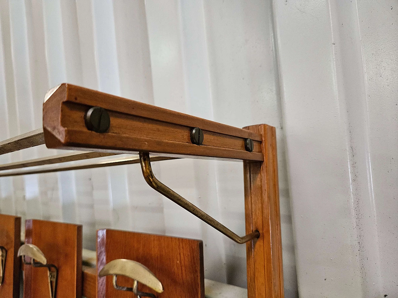 Wall-mounted coat rack in wood, brass and skai, 1950s 8