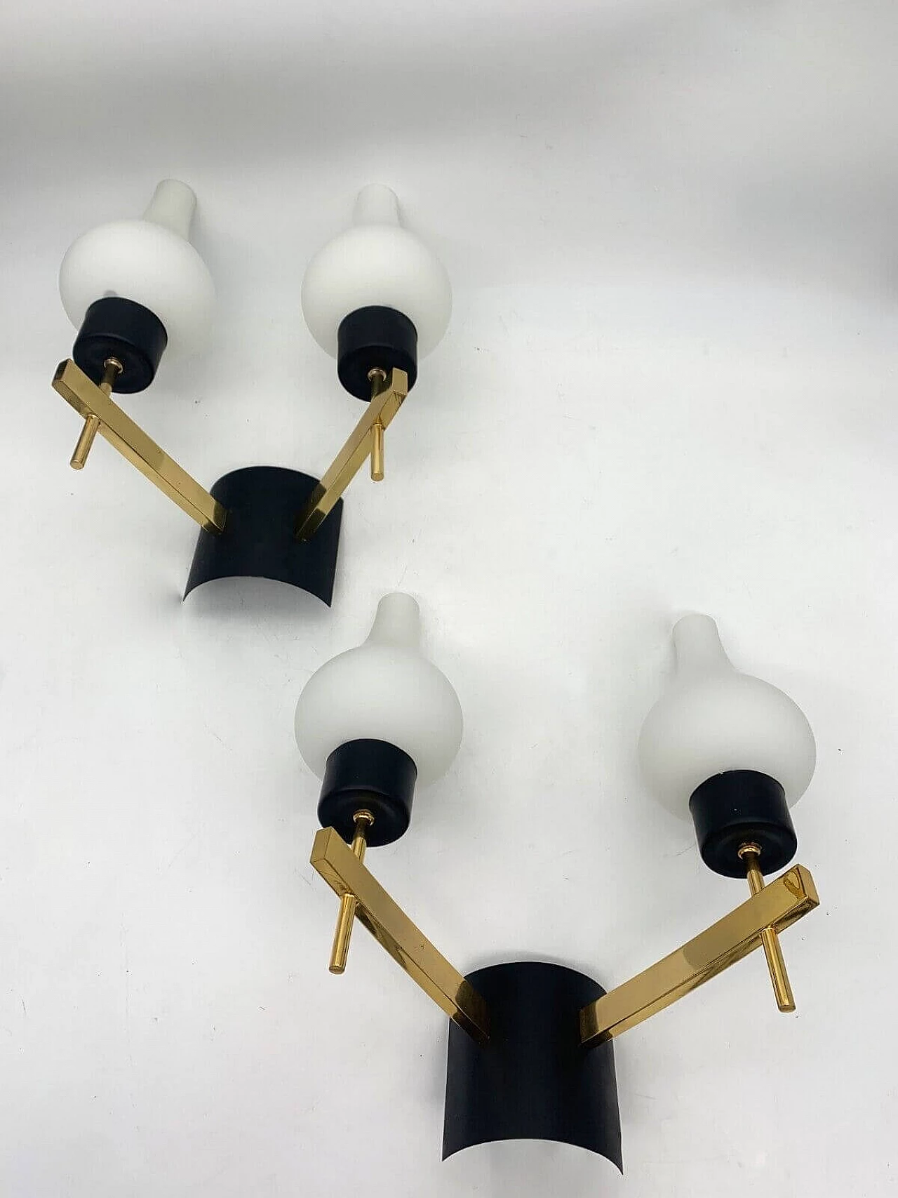 Pair of white, black and gold wall sconces attributed to Stilnovo, late 20th century 4