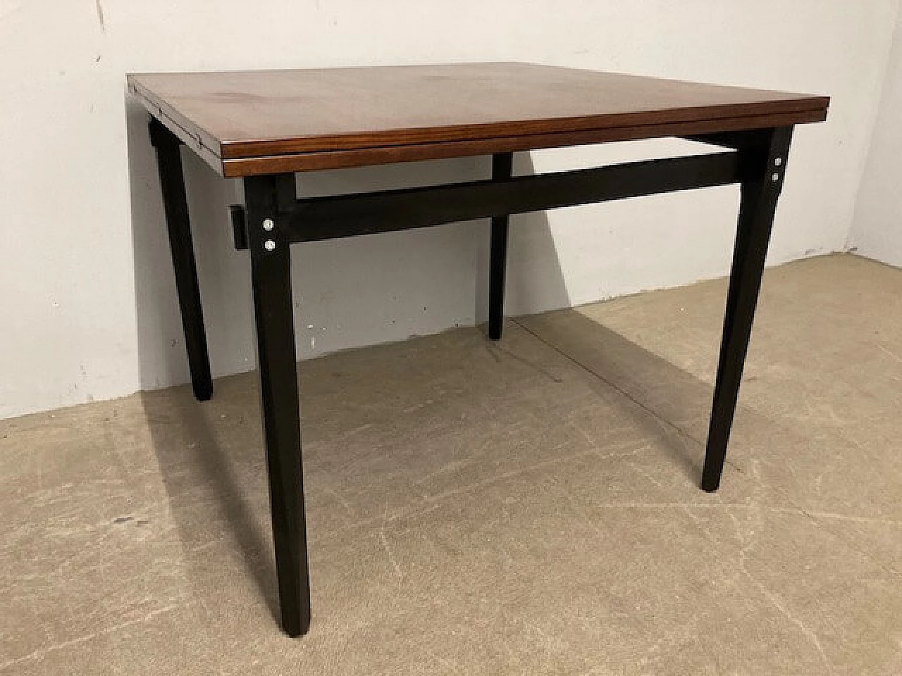 Rosewood extending table with black lacquered legs, 1960s 1