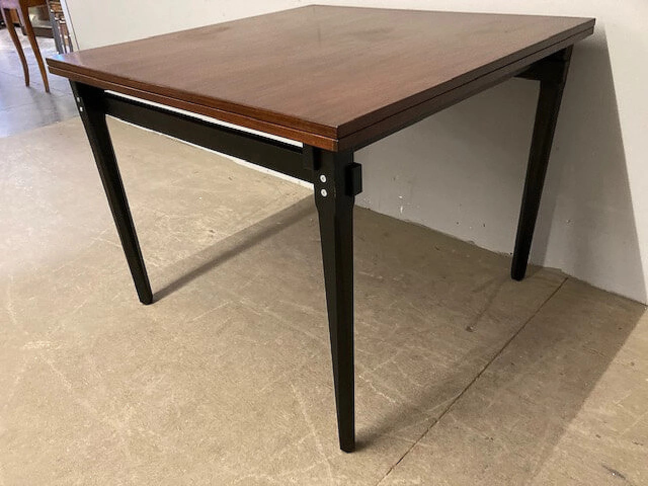Rosewood extending table with black lacquered legs, 1960s 3