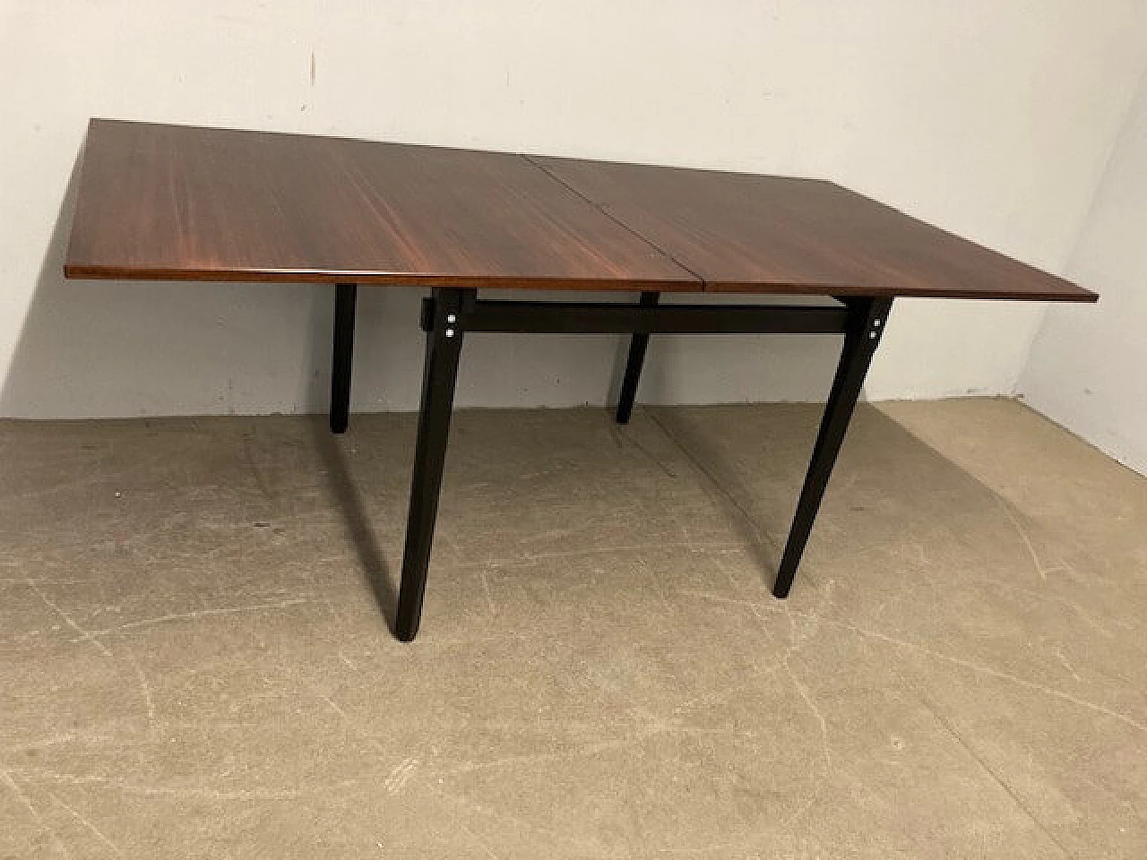 Rosewood extending table with black lacquered legs, 1960s 6