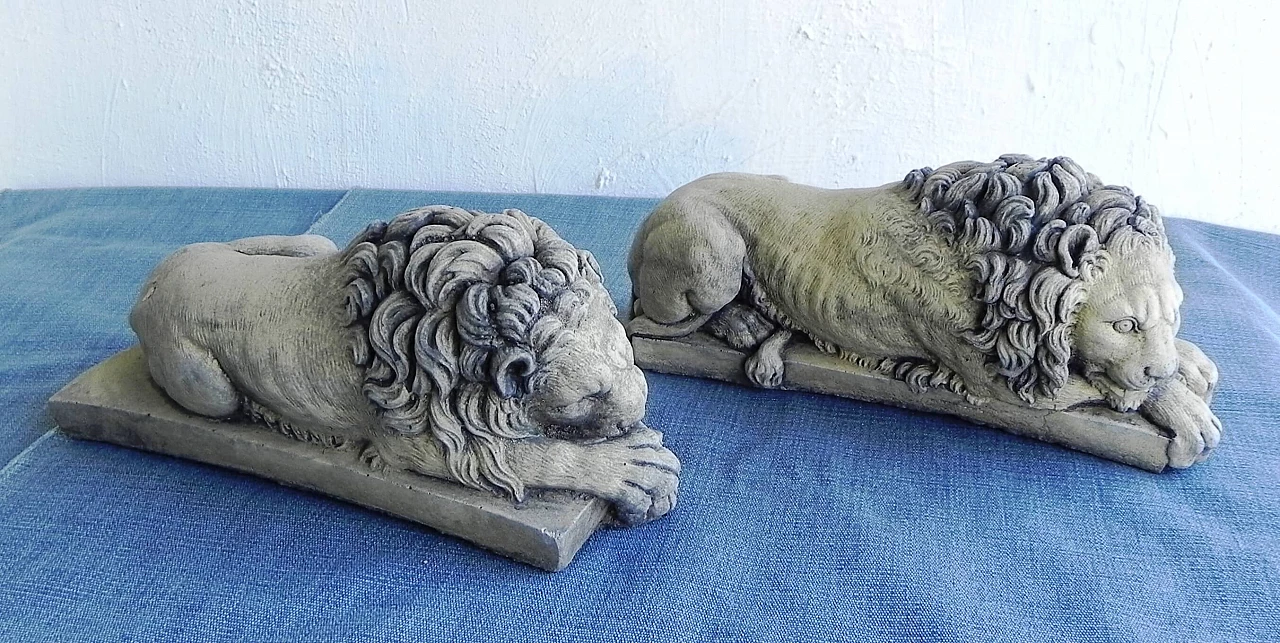 Pair of stone sculptures of sleeping lions 1
