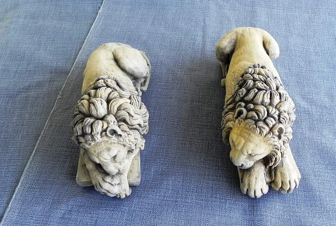 Pair of stone sculptures of sleeping lions 4