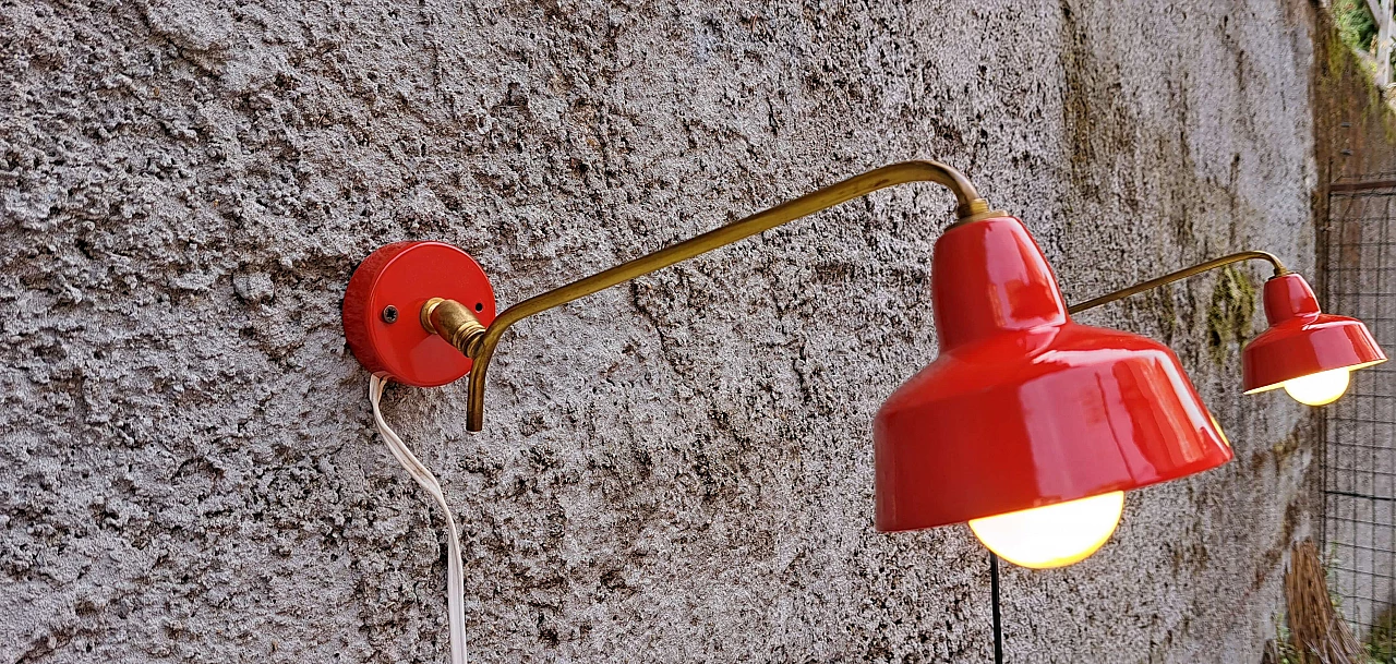 Pair of red enameled metal and brass wall lights, 1970s 3