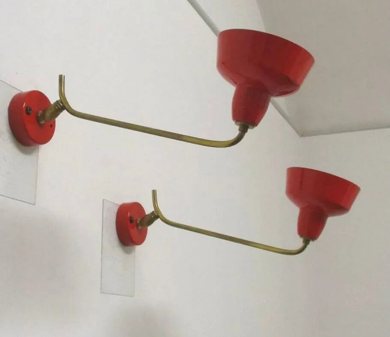 Pair of red enameled metal and brass wall lights, 1970s 5