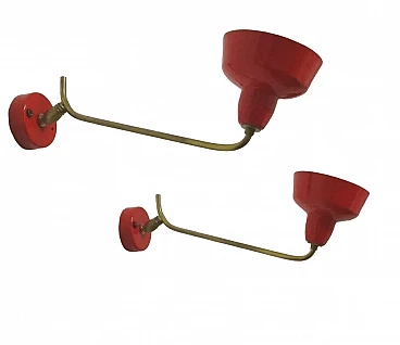 Pair of red enameled metal and brass wall lights, 1970s