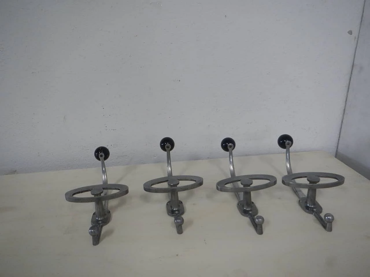 4 Wall coat racks in aluminum and bakelite, 1950s 1