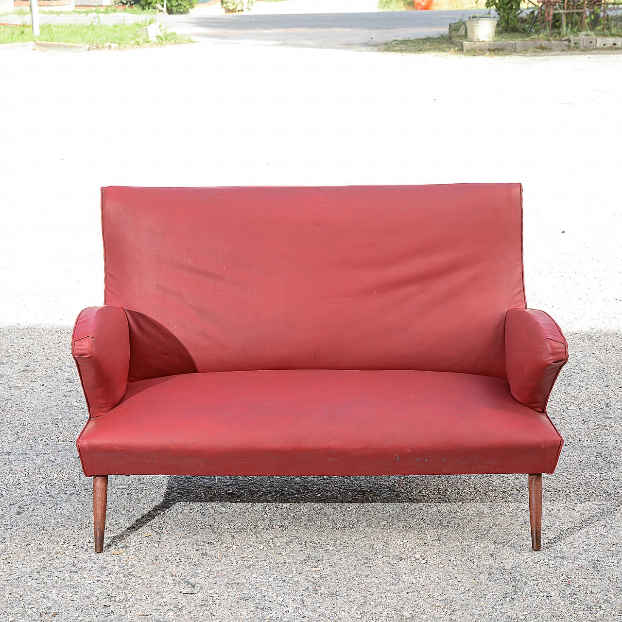Red leatherette sofa with flared wooden feet, 1950s 1