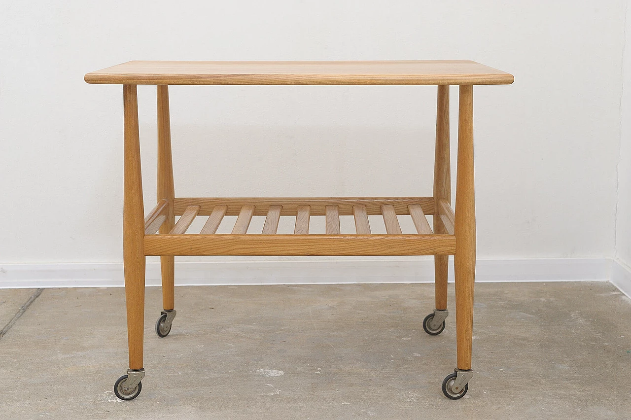 Beech coffee table with casters by Krásná Jizba, 1950s 5