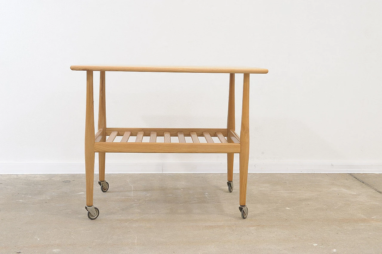 Beech coffee table with casters by Krásná Jizba, 1950s 12