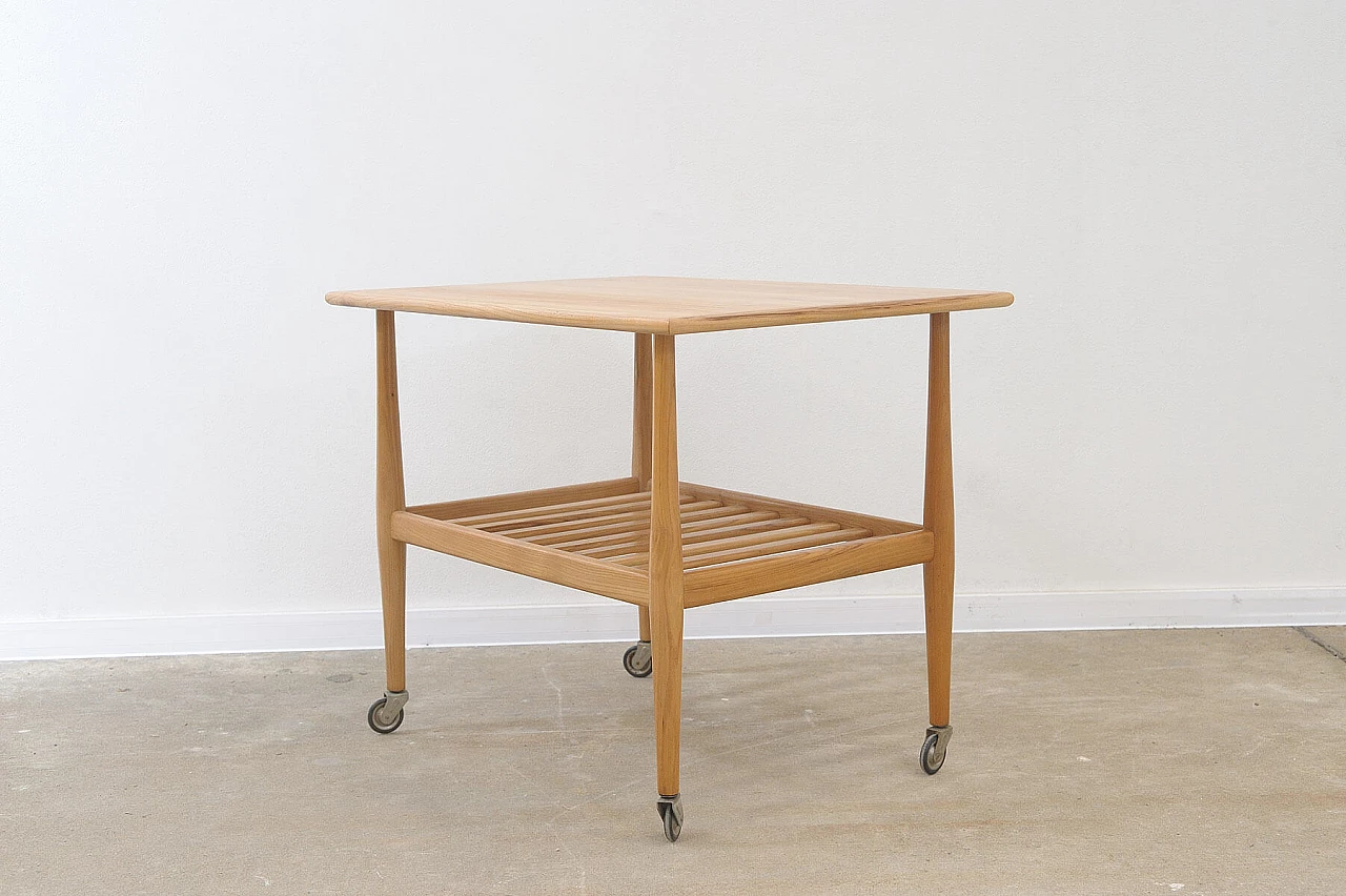 Beech coffee table with casters by Krásná Jizba, 1950s 14