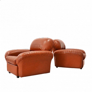 Pair of brick-coloured leather armchairs, 1970s