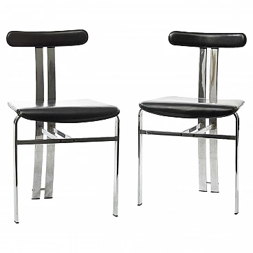 Pair of sculptural chairs in black leather and chrome-plated metal, 1970s