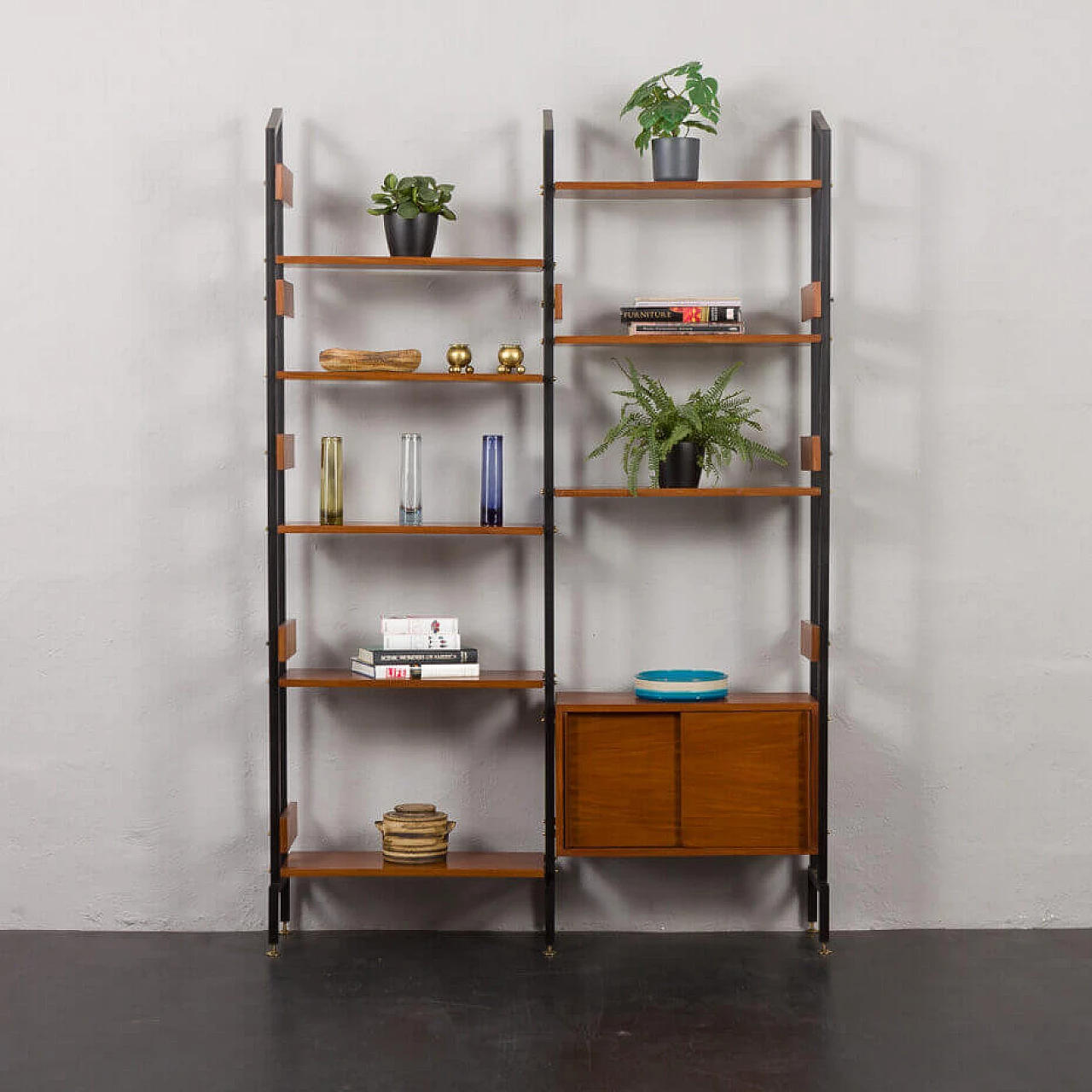 Two-bay bookcase with sliding doors and eight shelves, 1950s 1