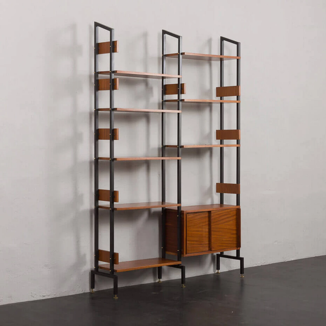 Two-bay bookcase with sliding doors and eight shelves, 1950s 3