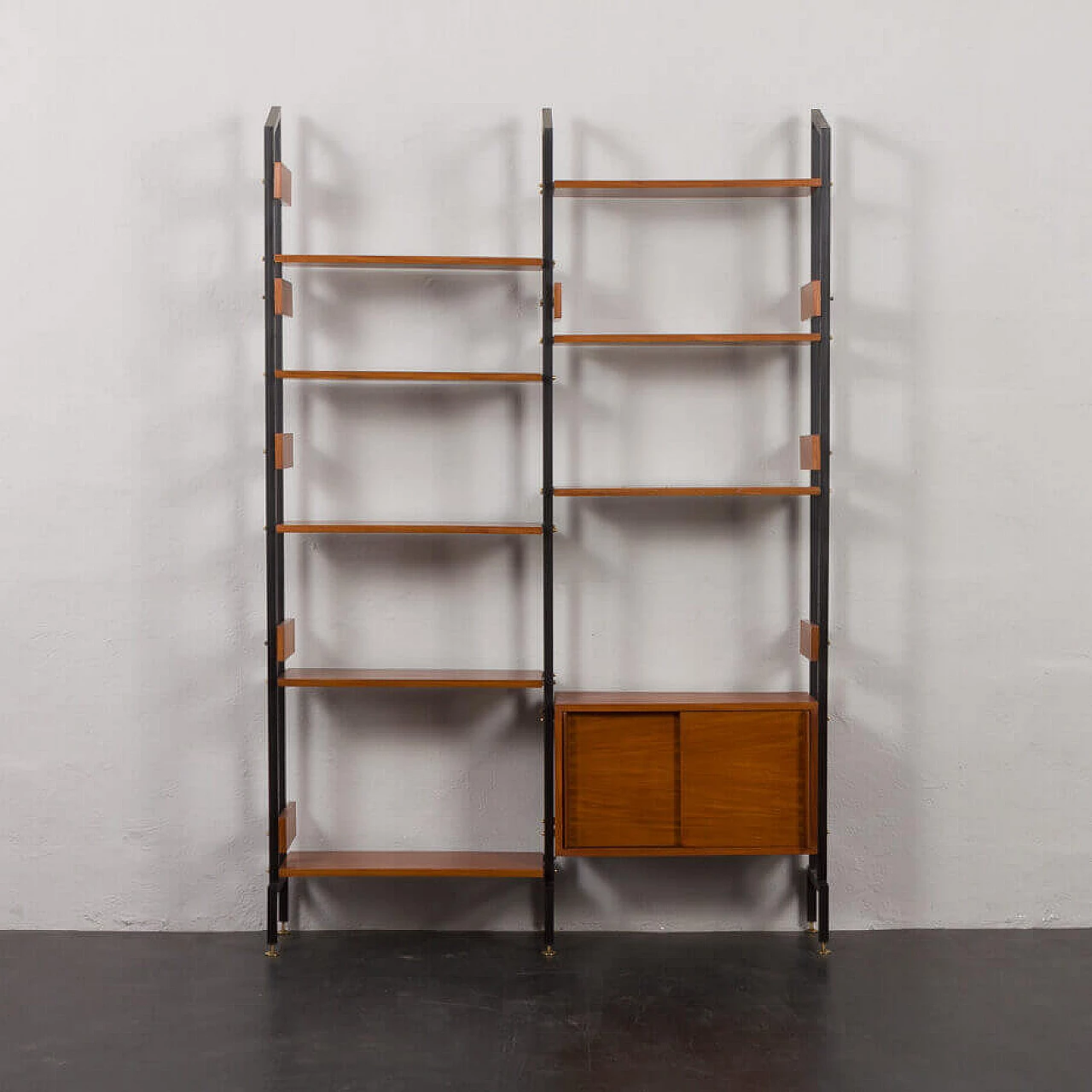 Two-bay bookcase with sliding doors and eight shelves, 1950s 6