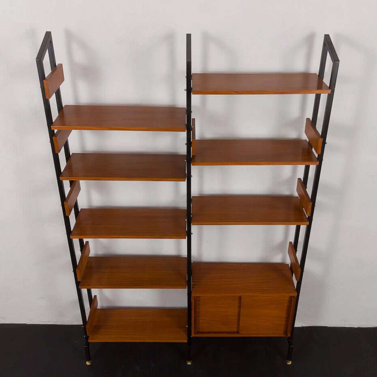 Two-bay bookcase with sliding doors and eight shelves, 1950s 7