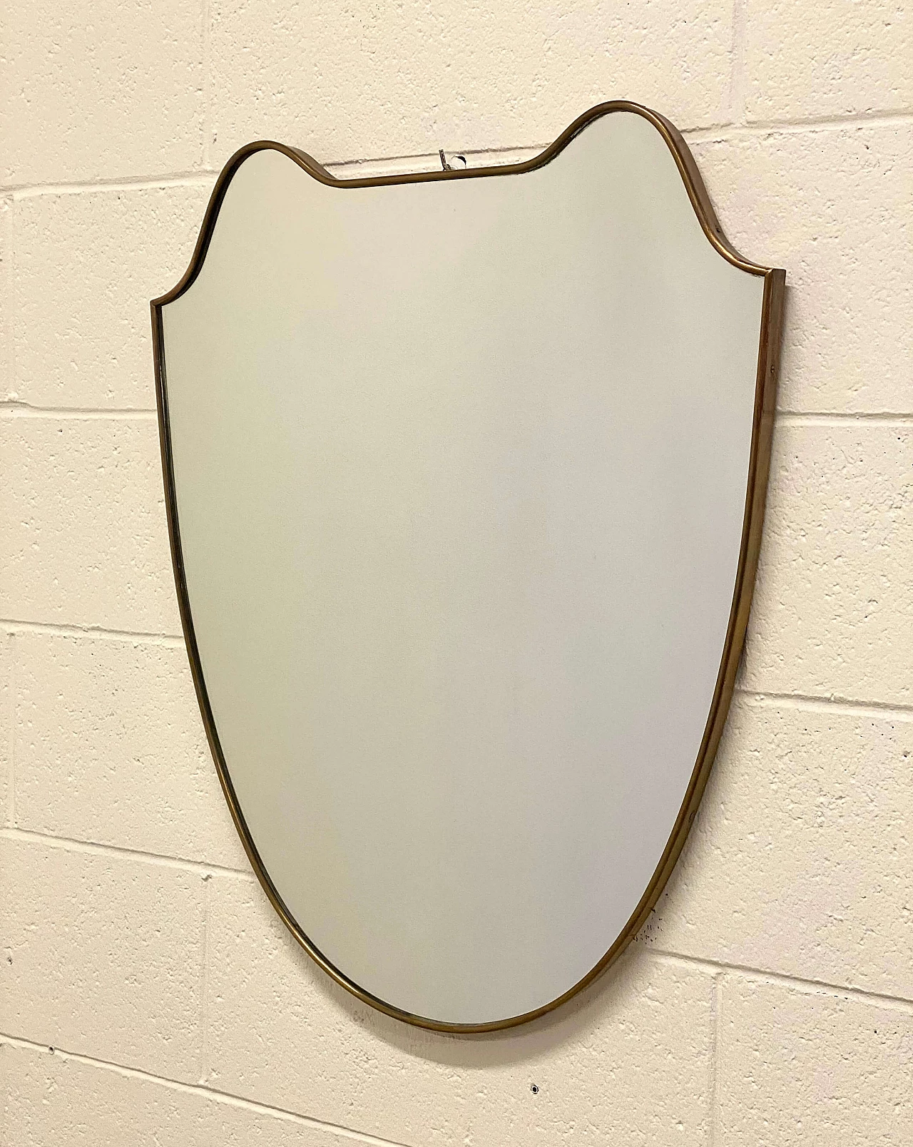Mirror with shaped brass frame in the style of Gio Ponti, 1950s 1