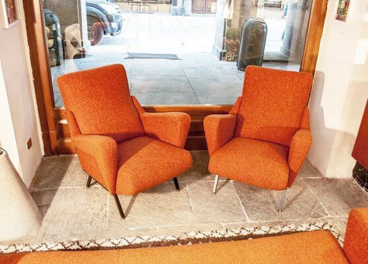 Orange armchair with iron legs and brass details, 1950s 1