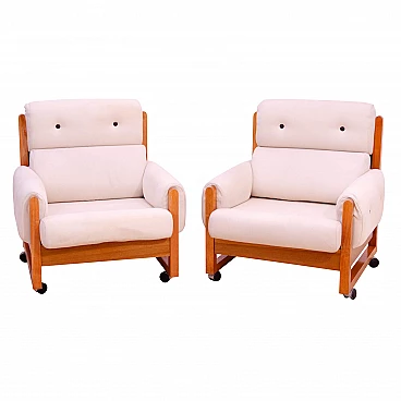 Pair of beech and fabric armchairs with casters, 1970s