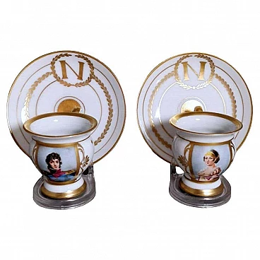 Pair of Napoleon III hand painted Limoges porcelain cups with saucers, late 19th century