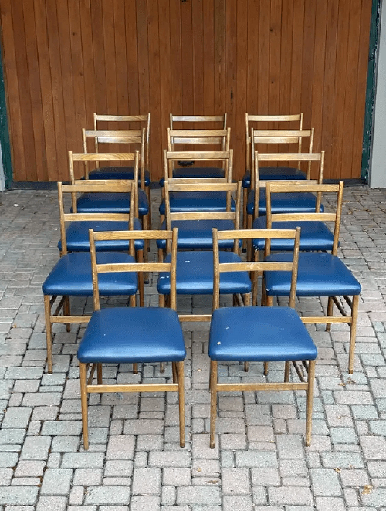 14 Dining chairs in wood and blue leather by Gio Ponti, 1970s 2