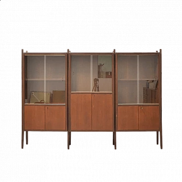 Three-bay wood cabinet with glass sliding doors, 1958