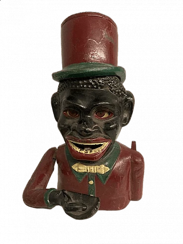 Hand-painted cast-iron money box with mechanism, early 20th century