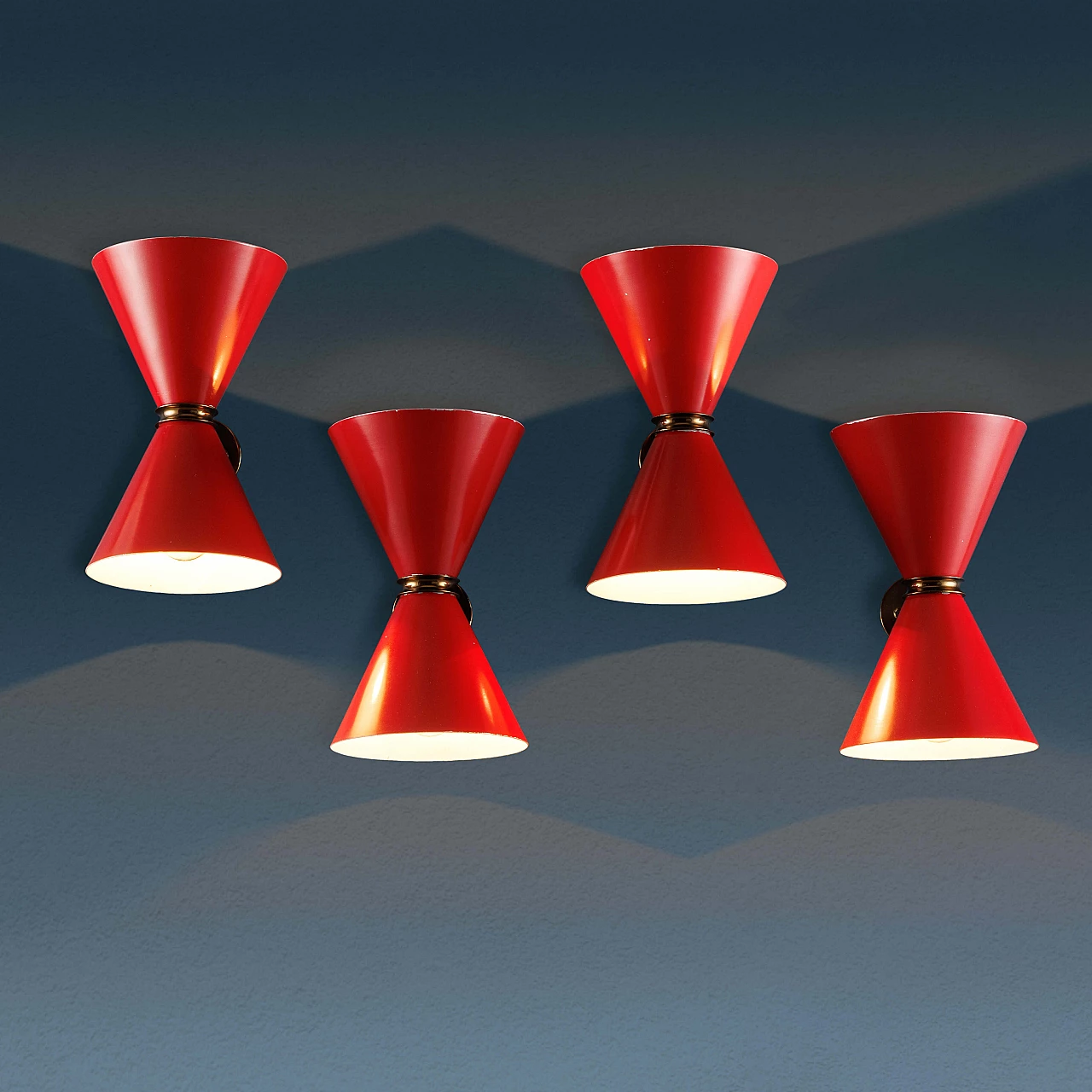 4 Enamelled red metal and brass wall lamps, 1960s 1