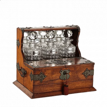 Oak and metal liquor box with crystal and silver bottles