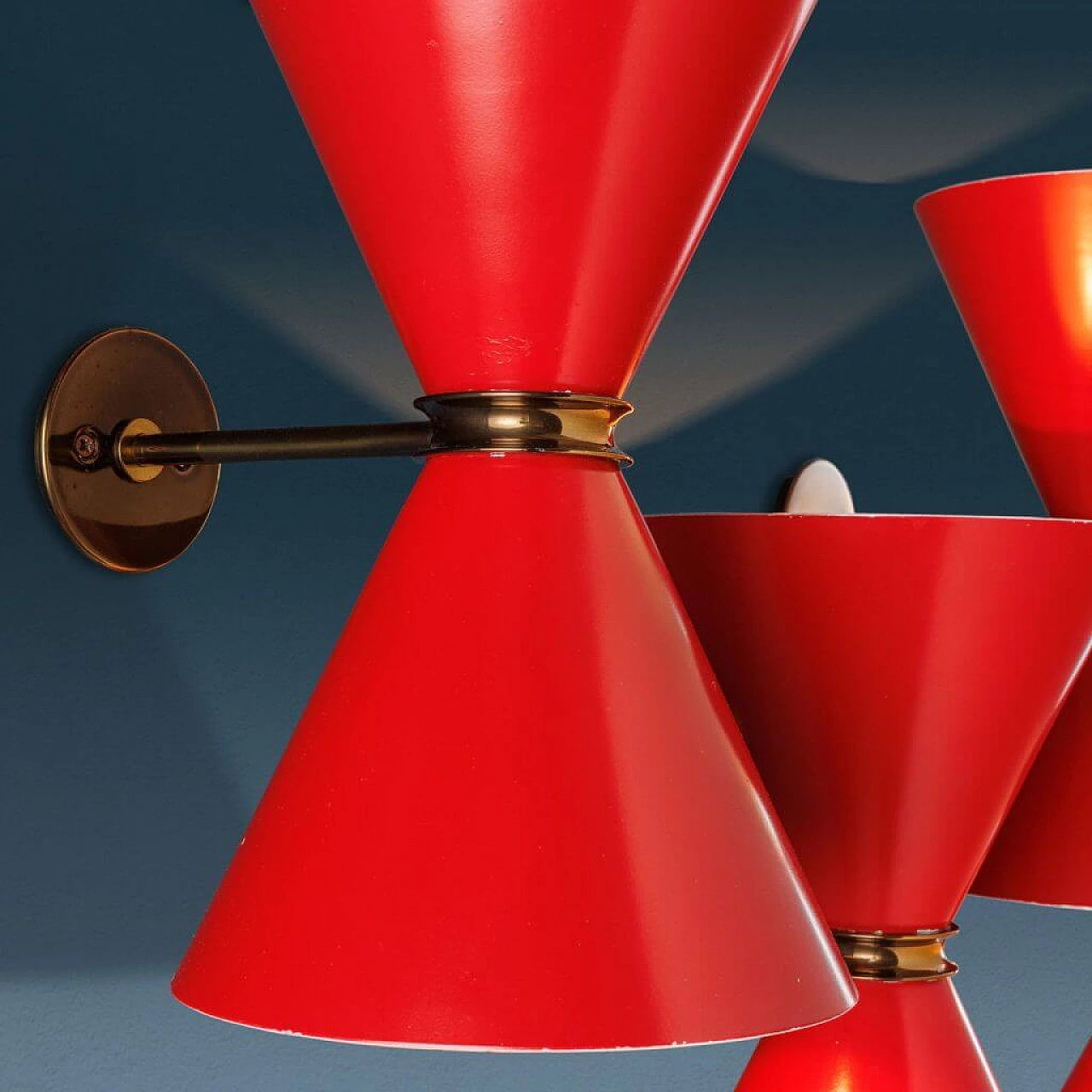 4 Enamelled red metal and brass wall lamps, 1960s 4