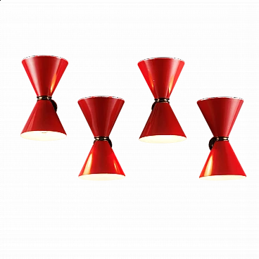 4 Enamelled red metal and brass wall lamps, 1960s