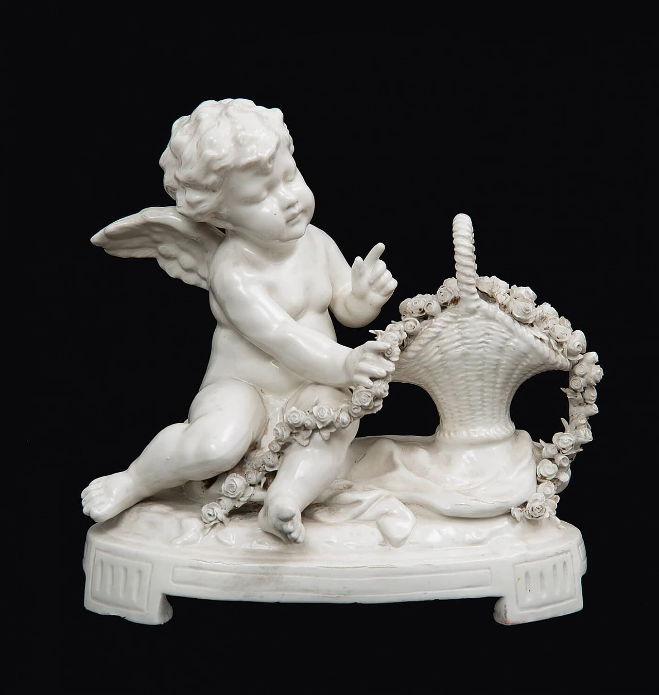 Putto with basket of flowers, Capodimonte porcelain sculpture, early 20th century 1