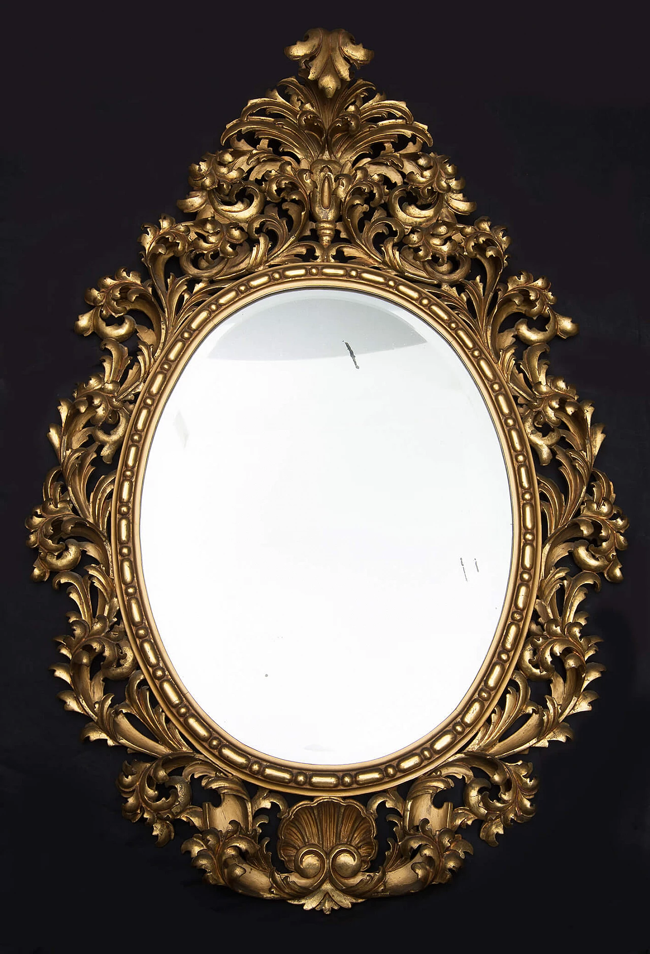 Florentine oval mirror in gilded and carved wood, late 19th century 1