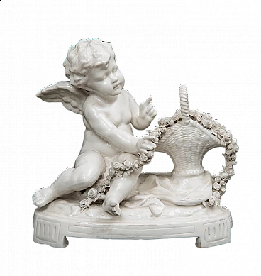 Putto with basket of flowers, Capodimonte porcelain sculpture, early 20th century