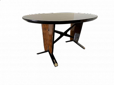 Oval ebonized wood, mahogany and black glass table, 1950s