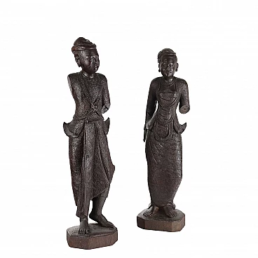 Coppia di sculture in legno raffiguranti figure birmane, inizio '900