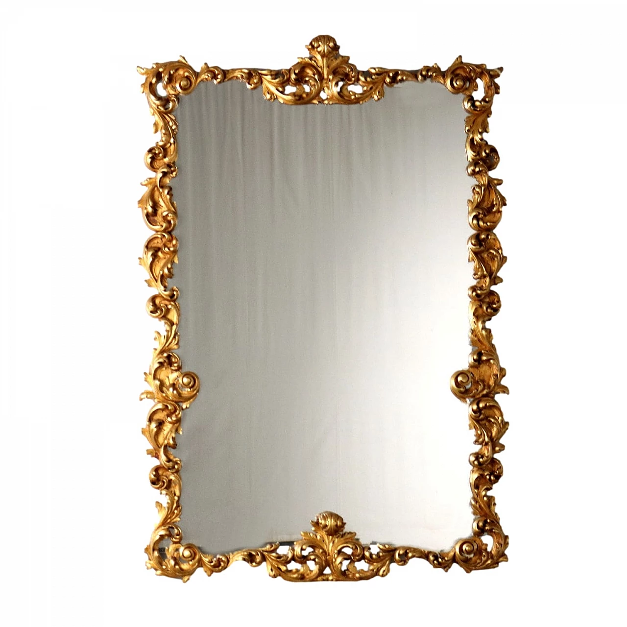 Mirror with frame carved with leaf scrolls and gilded 1