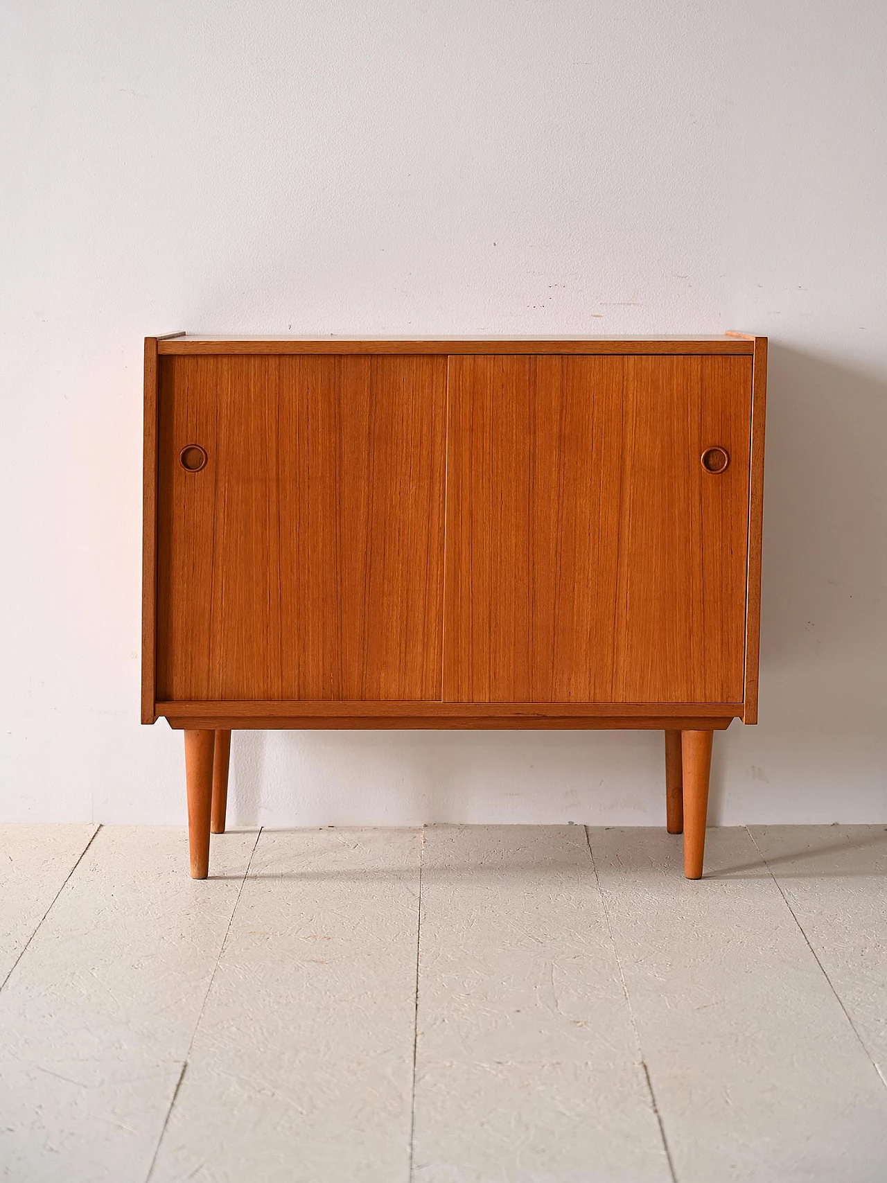 Teak sideboard with sliding doors with cone-shaped legs, 1960s 2