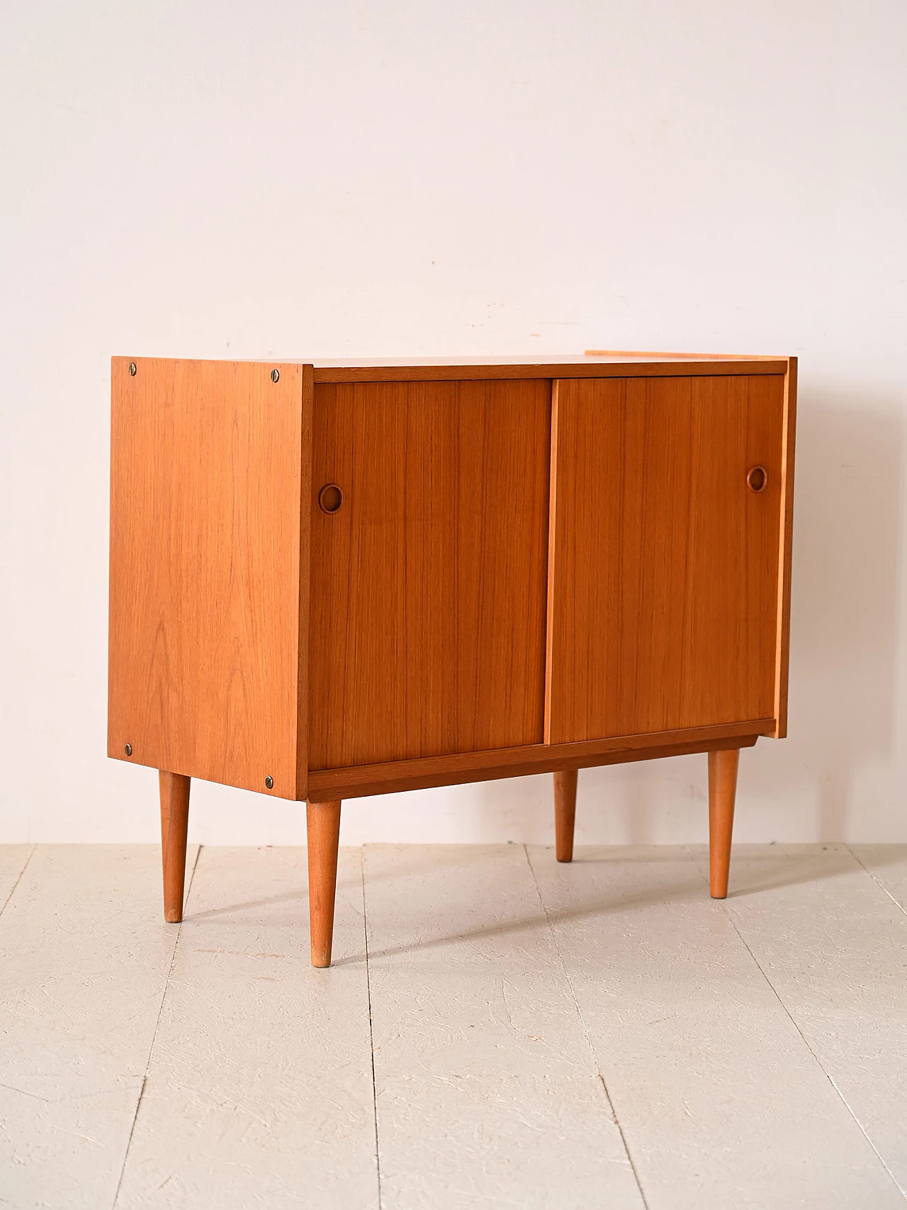 Teak sideboard with sliding doors with cone-shaped legs, 1960s 5